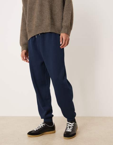 ASOS DESIGN tapered cuffed jogger in navy