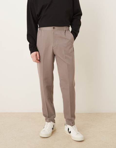 ASOS DESIGN tapered dress pants in brown with elastic waist - view 1