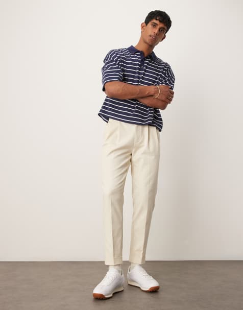 ASOS DESIGN tapered dress pants with exposed buttons in beige - view 1