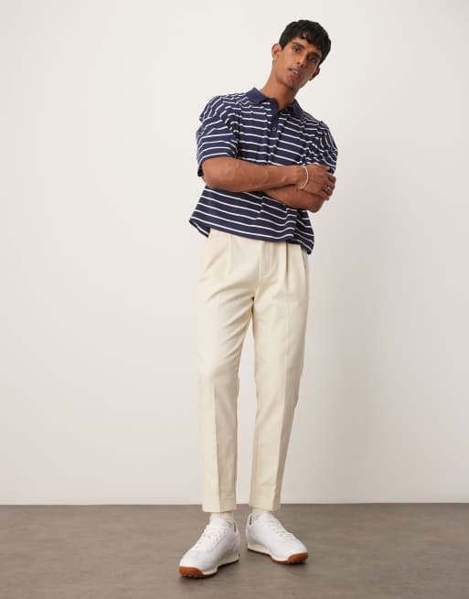 ASOS DESIGN tapered dress pants with exposed buttons in beige