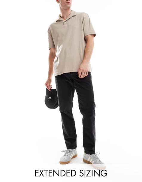 ASOS DESIGN tapered fit cord pants in navy - view 1