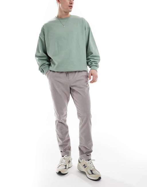 ASOS DESIGN tapered fit cord pants with elasticated waist in gray