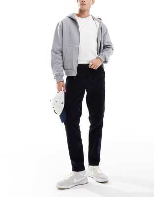 ASOS DESIGN tapered fit cord trouser in navy  - view 1