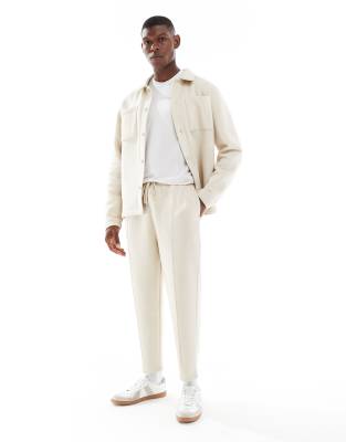 Asos Design Tapered Fit Fixed Hem Sweatpants With Pleats In Neutral