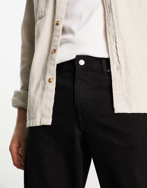 ASOS DESIGN tapered fit jeans in black wash with knee rips , 3 of 4