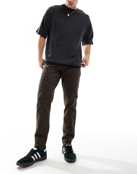 ASOS DESIGN tapered fit jeans in brown wash - view 1
