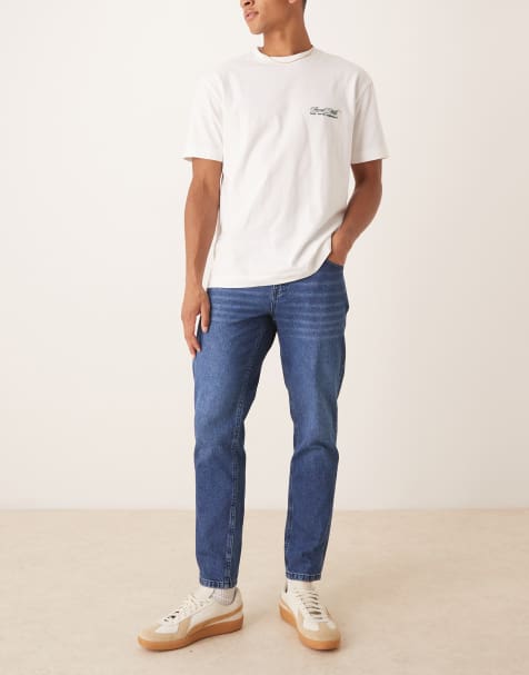 ASOS DESIGN tapered fit  jeans in dark wash blue - view 1