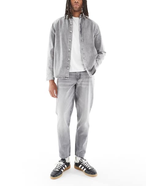 ASOS DESIGN tapered fit jeans in light gray wash - view 1