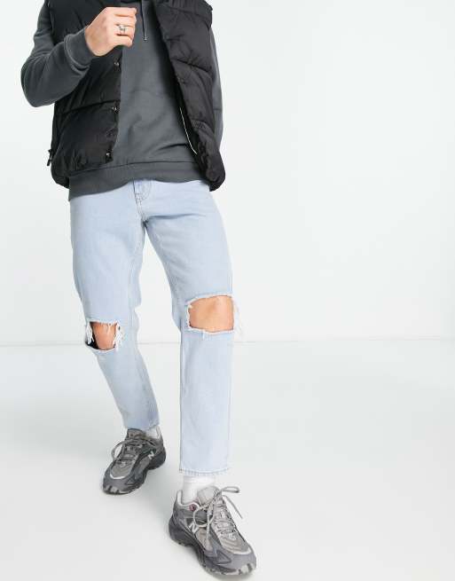 ASOS DESIGN tapered fit jeans in light stone wash with elasticated waist and rips  - LBLUE