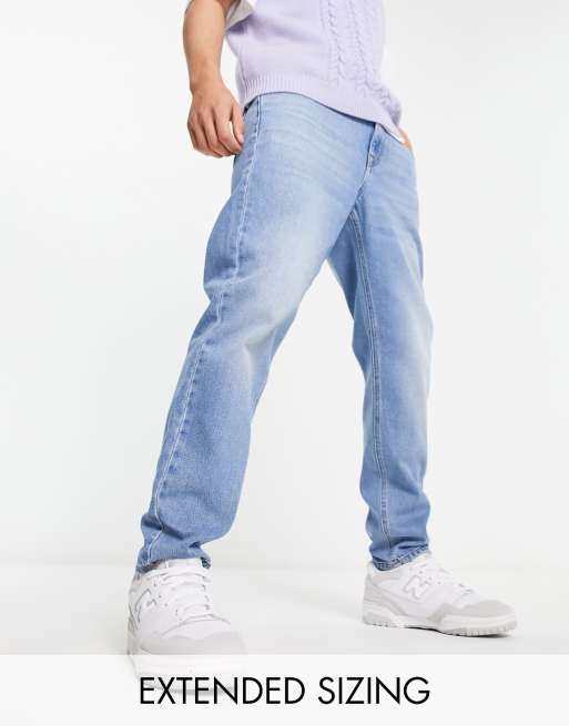 ASOS DESIGN tapered fit jeans in light wash blue  - LBLUE