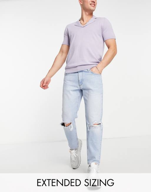 ASOS DESIGN tapered fit jeans in light wash blue with busted knees - LBLUE