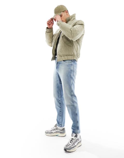 ASOS DESIGN tapered fit jeans in light wash blue
