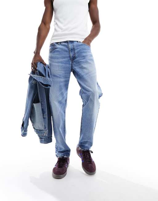 ASOS DESIGN tapered fit jeans in light wash blue
