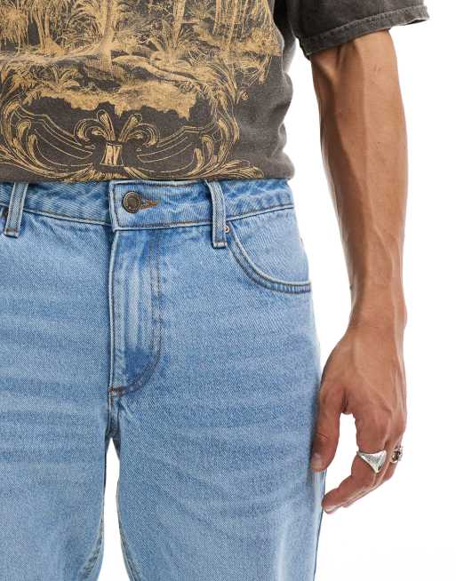 ASOS DESIGN tapered fit jeans in light wash blue 