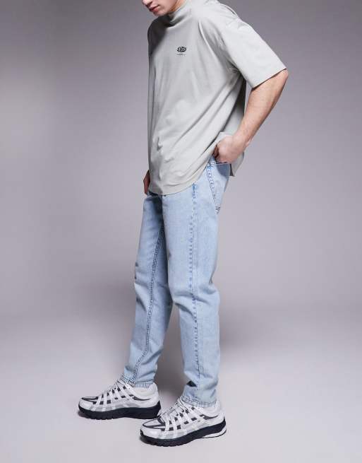 ASOS DESIGN tapered fit jeans in light wash blue, 3 of 5
