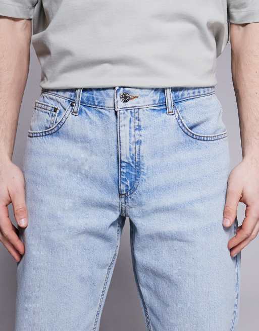 ASOS DESIGN tapered fit jeans in light wash blue, 5 of 5