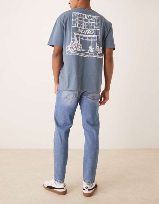 ASOS DESIGN tapered fit jeans in light wash blue