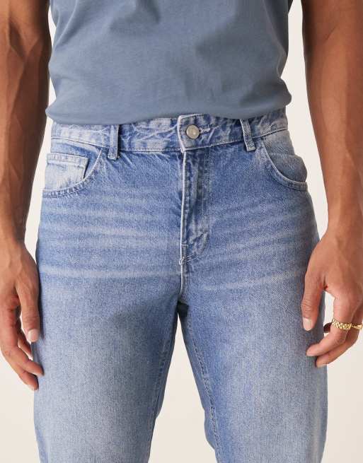 ASOS DESIGN tapered fit jeans in light wash blue