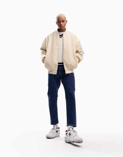 ASOS DESIGN tapered fit jeans in mid stone wash blue   - MBLUE
