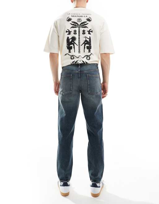 ASOS DESIGN tapered fit jeans in mid wash blue with tint , 2 of 5