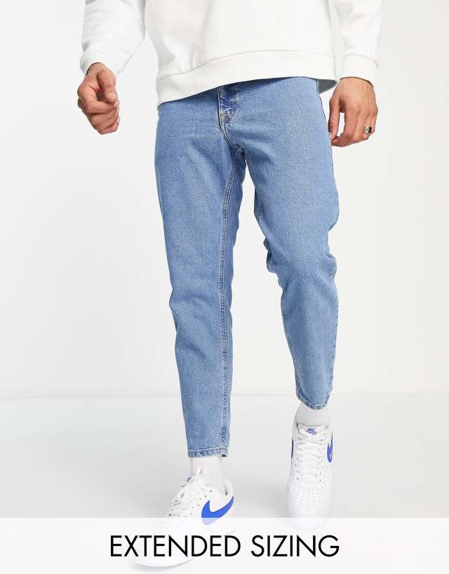 ASOS DESIGN - tapered fit jeans in mid wash blue