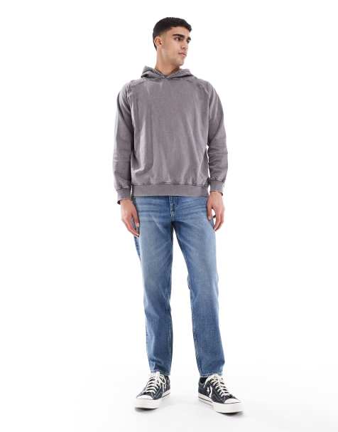 ASOS DESIGN tapered fit jeans in mid wash blue - view 1