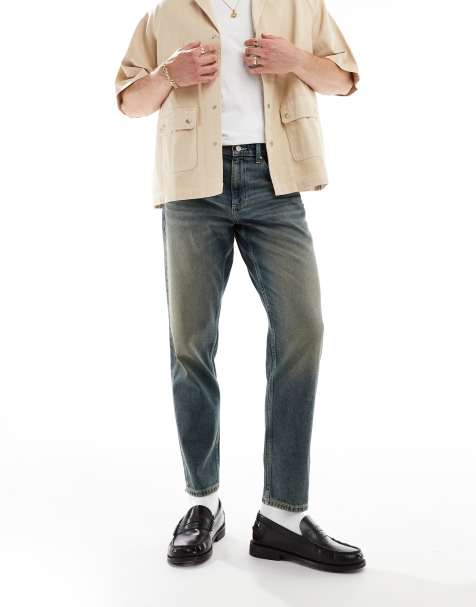 ASOS DESIGN tapered fit jeans in mid wash blue - view 1