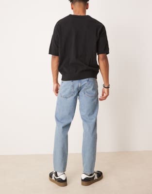 ASOS DESIGN tapered fit jeans in mid wash blue  