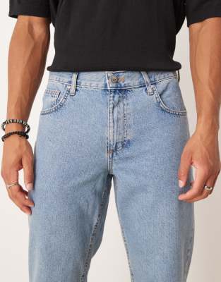 ASOS DESIGN tapered fit jeans in mid wash blue  