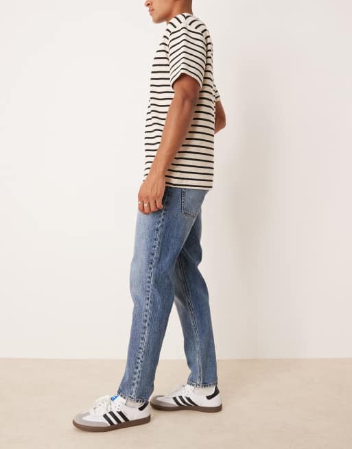 ASOS DESIGN tapered fit jeans in mid wash blue, 3 of 5
