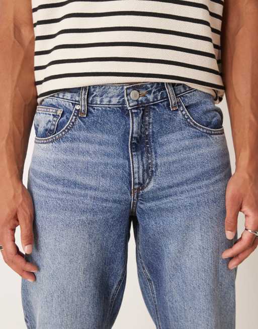 ASOS DESIGN tapered fit jeans in mid wash blue, 4 of 5