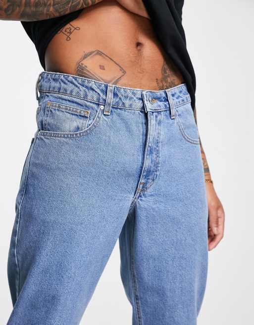 ASOS DESIGN tapered fit jeans in mid wash blue , 3 of 4