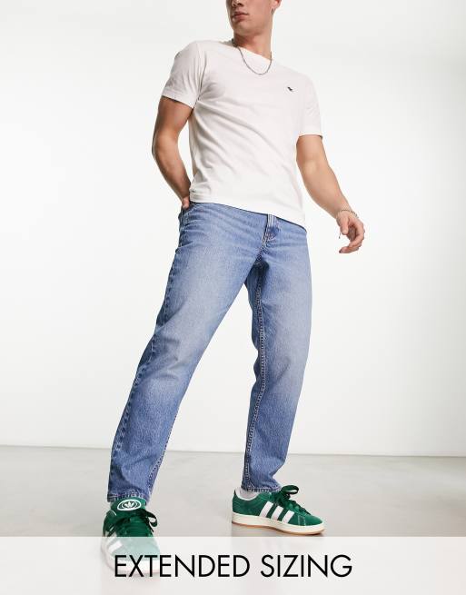 ASOS DESIGN tapered fit jeans in midwash blue - MBLUE