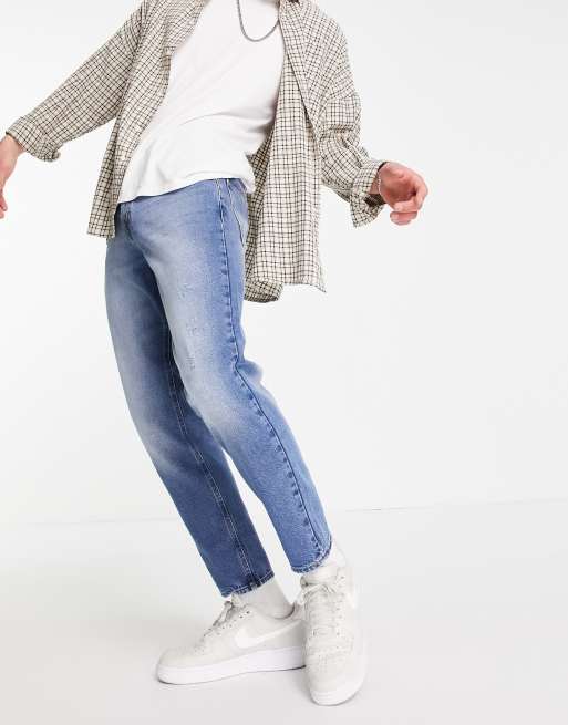 ASOS DESIGN tapered fit jeans in vintage mid wash blue 