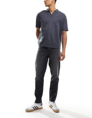 ASOS DESIGN tapered fit jeans in washed black
