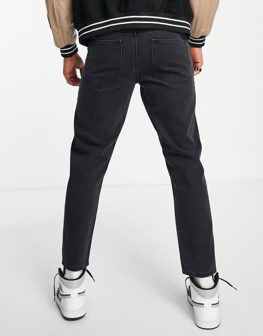 ASOS DESIGN tapered fit jeans in washed black , 2 of 4