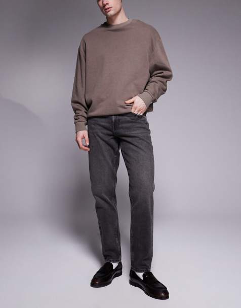 ASOS DESIGN tapered fit jeans in washed grey black - view 1
