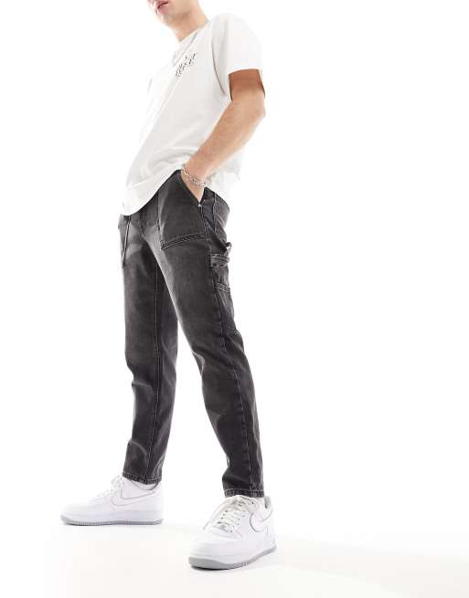 ASOS DESIGN tapered fit jeans with carpenter detail in washed black