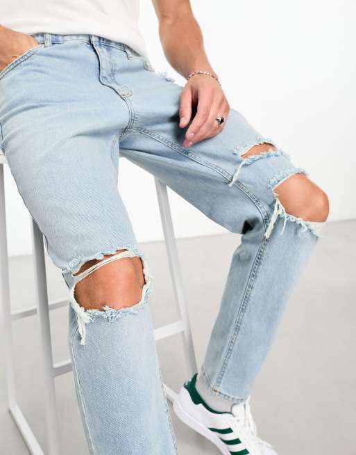 ASOS DESIGN tapered fit jeans with heavy knee rips in light wash blue , 3 of 4