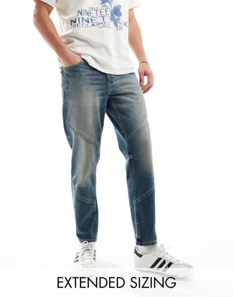 ASOS DESIGN tapered fit jeans with panelling in a vintage tint dark blue - TURQUOISE - view 1