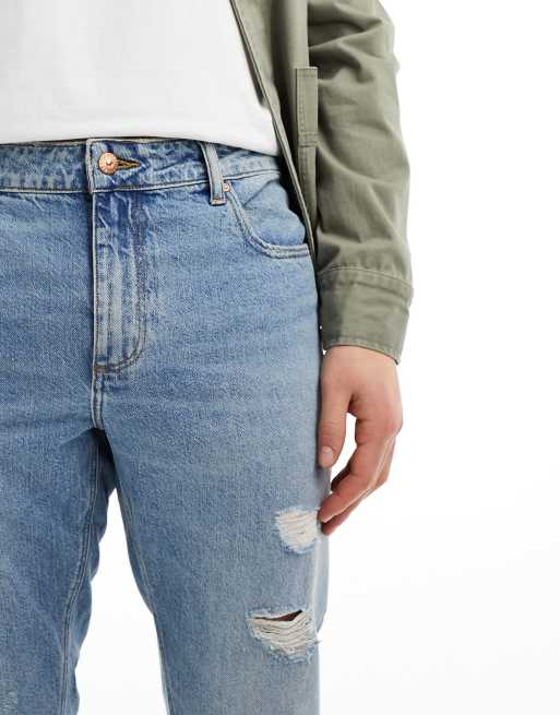 ASOS DESIGN tapered fit jeans with rips in light wash blue , 4 of 5
