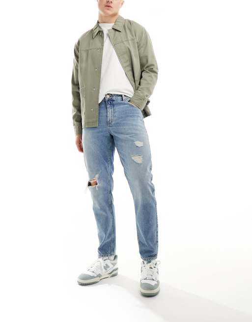 ASOS DESIGN tapered fit jeans with rips in light wash blue , 5 of 5