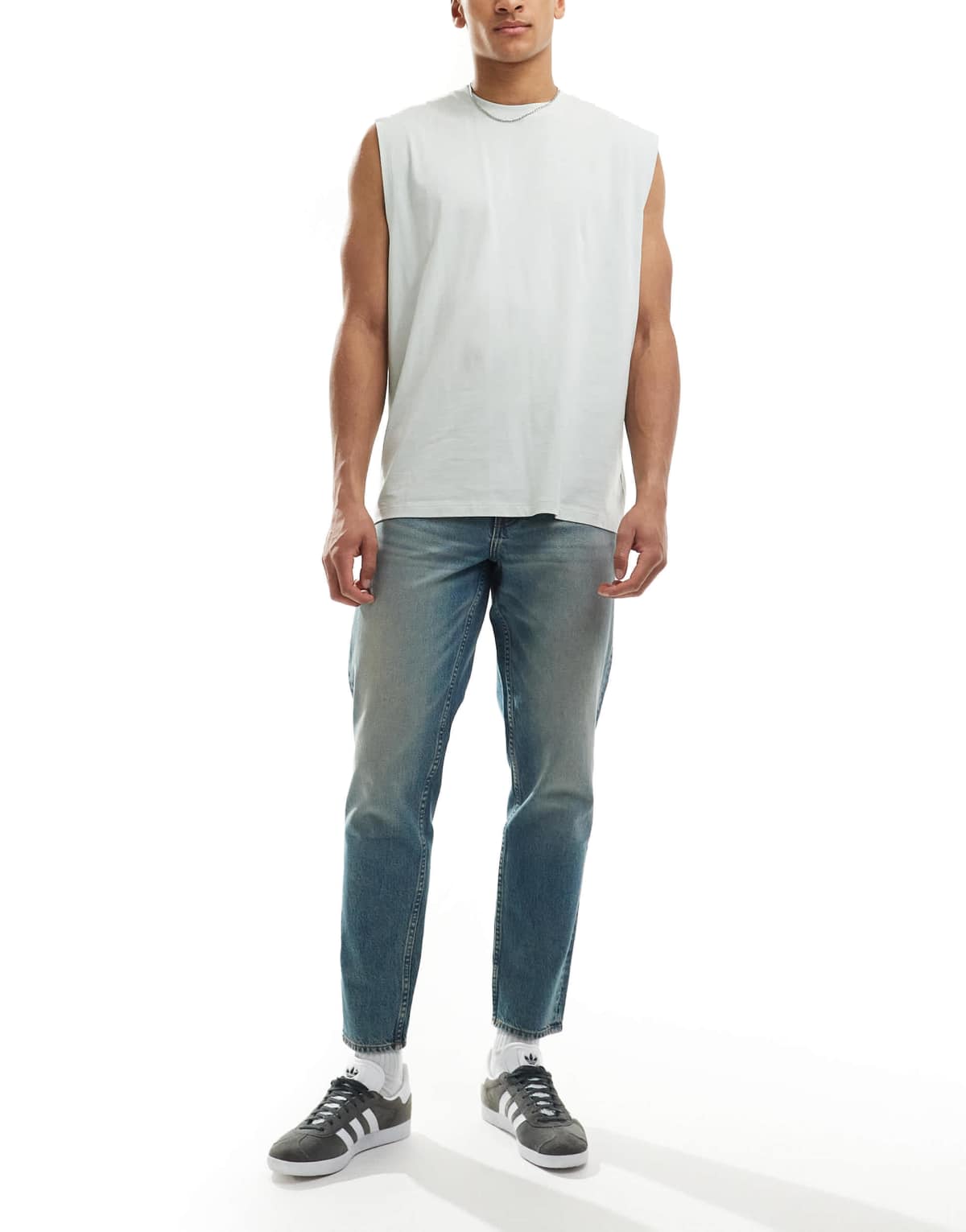 ASOS DESIGN tapered fit jeans with tint in light wash blue