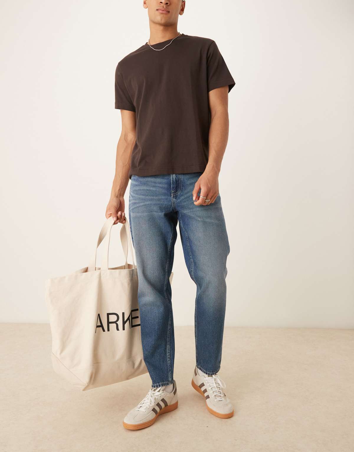 ASOS DESIGN tapered fit jeans with vintage tint in light wash blue