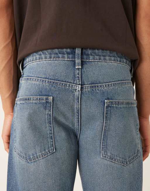 ASOS DESIGN tapered fit jeans with vintage tint in light wash blue, 4 of 5