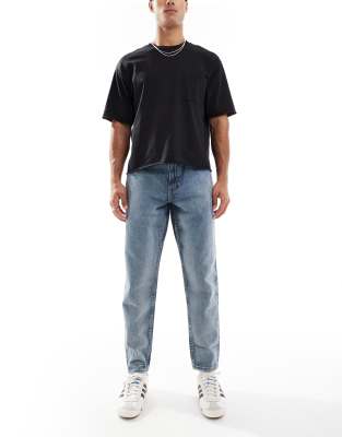 Asos Design Tapered Fit Jeans With Vintage Tint In Blue