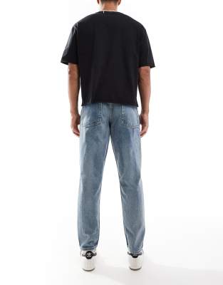 Asos Design Tapered Fit Jeans With Vintage Tint In Blue