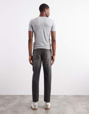 Asos Design Tapered Fit Jeans With Yellow Tint In Black