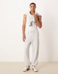 [ASOS DESIGN] ASOS DESIGN tapered fit loopback trackies in grey marl XL Grey marle