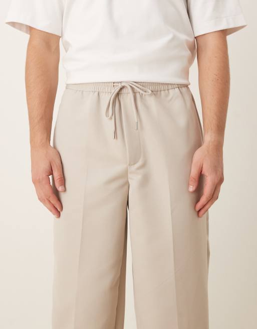 ASOS DESIGN tapered fit smart pants with elastic waistband in stone, 4 of 5